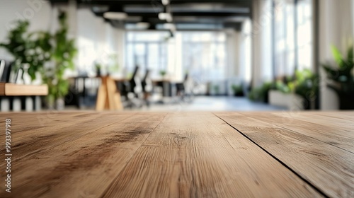 Clean wooden table surface in focus, with a softly blurred modern office space in the background, evoking a professional work environment.