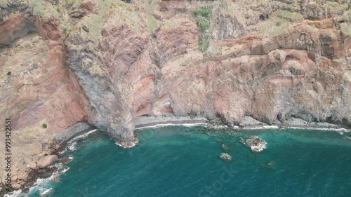 Rocky coastline of the Portuguese island of Madeira near Christo Rei, Canico. Drone aerial video.