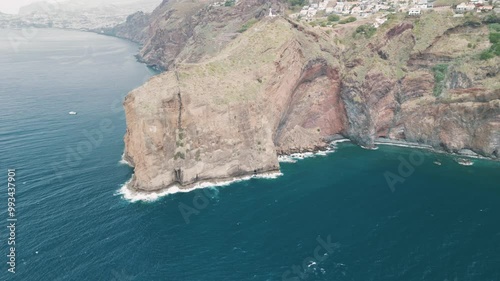 Peninsula with Christo Rei (Christ's Monument) on the Madeira Island near Canico, Portugal. Aerial drone video.