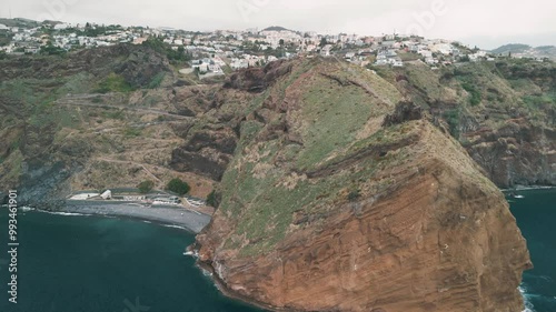 Peninsula with Christo Rei (Christ's Monument) on the Madeira Island near Canico, Portugal. Aerial drone video.