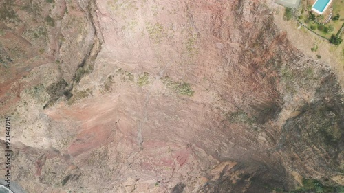 People visiting the viewpoint on Cabo Girao located on the cliff on the Madeira Island, Portugal. Top down view from the cliff.