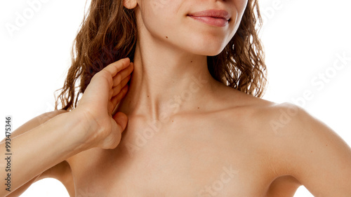 Cropped photo of young woman's neckline with soft, smooth, toned skin against white studio background. Concept of beauty treatment, fashion, appearance, self care, spa procedures. Ad