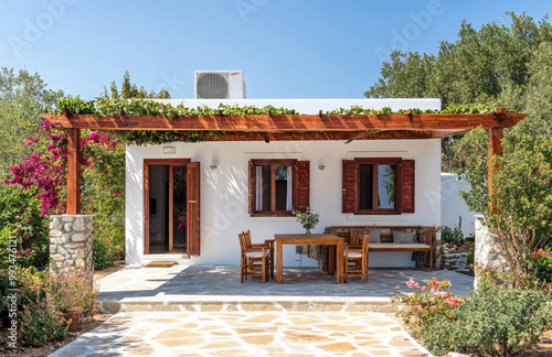 a modern Greek-style covered porch with red wooden beams and greenery, a small garden in front of the house