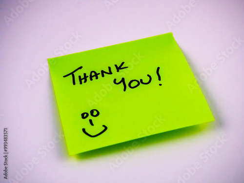 Green thank you note with a happy face