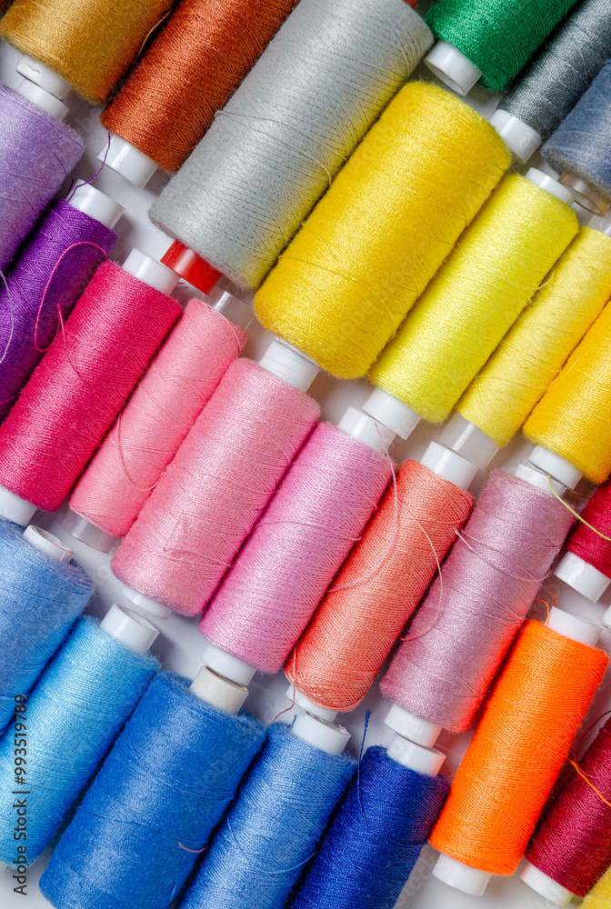 Top view of many colorful thread spools background Top view of many colorful thread spools background