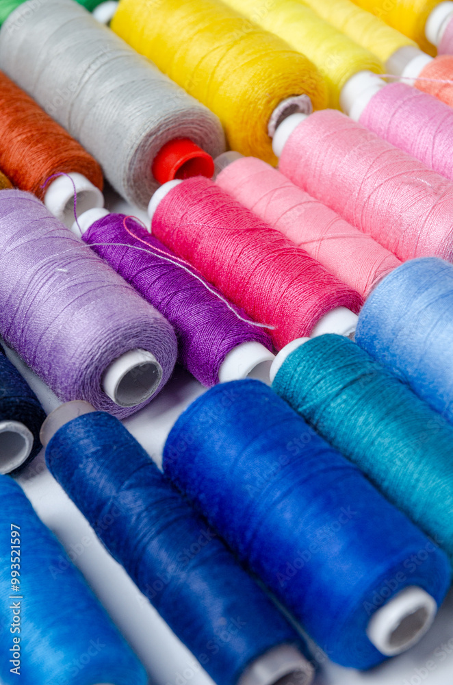 Top view of many colorful thread spools background Top view of many colorful thread spools background