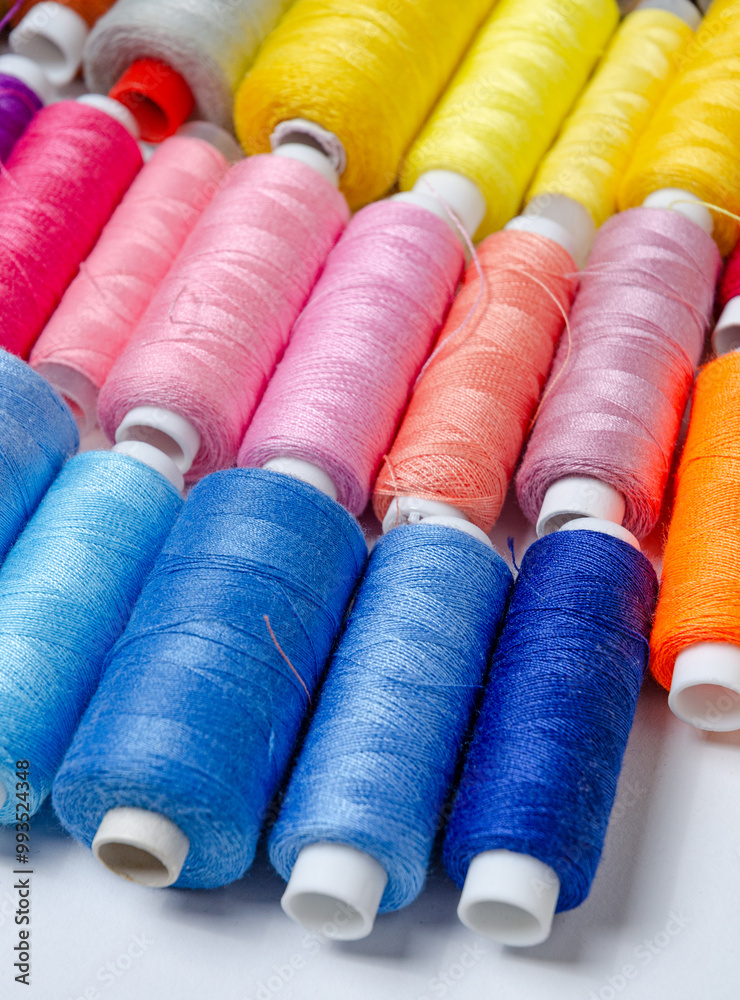Top view of many colorful thread spools background Top view of many colorful thread spools background
