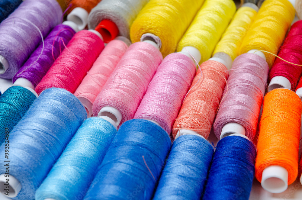 Top view of many colorful thread spools background Top view of many colorful thread spools background
