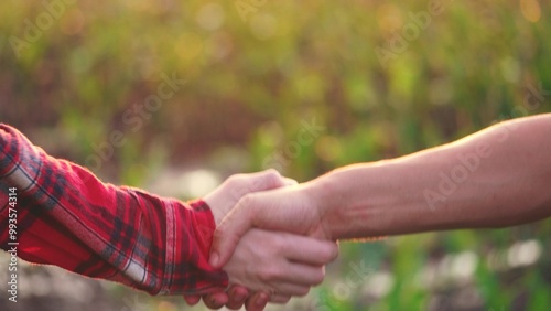 farmers handshake. sealing the agreement between farmers with a handshake. farming business concept. two male farmers shaking hands in order to confirm the sale agreement between lifestyle them