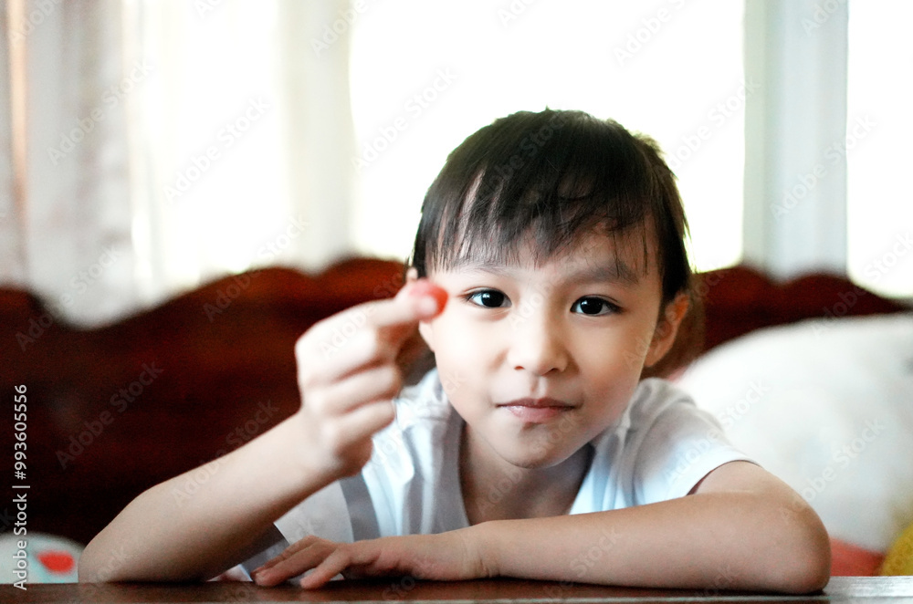 Little girl eating gelatin candy. Happy kid with vitamin. Little girl eating gelatin candy. Happy kid with vitamin.