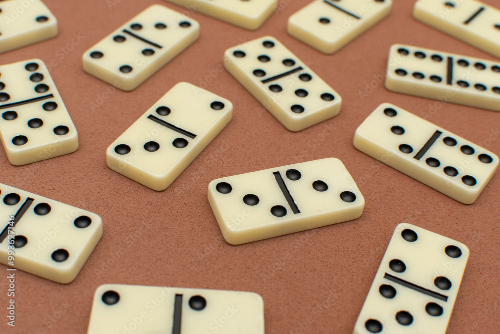 Dominoes bones on brown background Dominoes bones on brown background