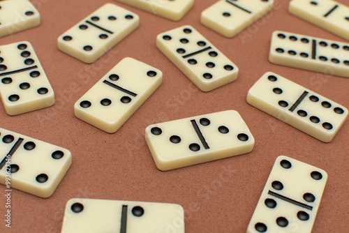 Dominoes bones on brown background 