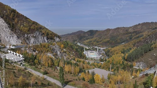 Picturesque mountain gorge and Medeu skating rink in the vicinity of the Kazakh city of Almaty on an autumn day photo