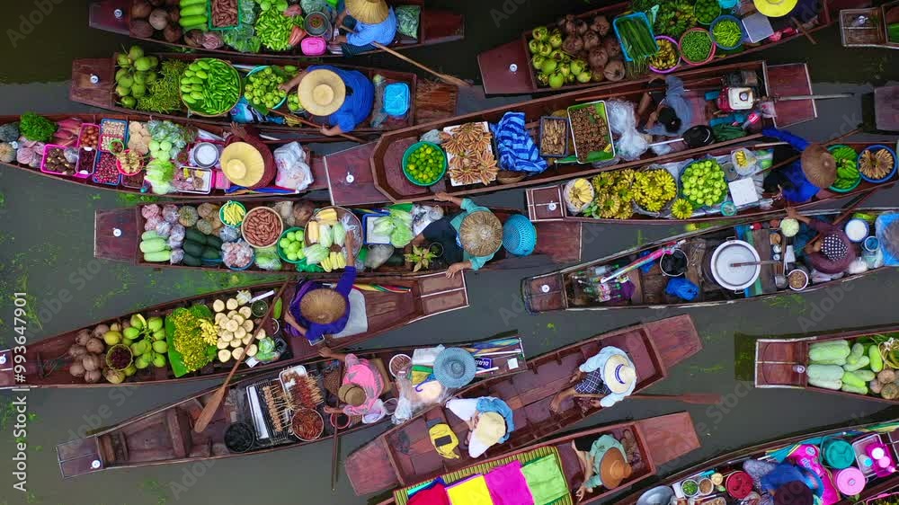 Aerial view Damnoen Saduak floating market, Farmer go to sell organic product, fruit, vegetable and Thai cuisine, Tourist visiting by boat, Ratchaburi, Thailand, Famous floating market in Thailand.