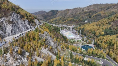 Picturesque mountain gorge and Medeu skating rink in the vicinity of the Kazakh city of Almaty on an autumn day photo