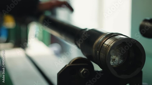 Worker twists a pipe cardan drive shaft close-up shot