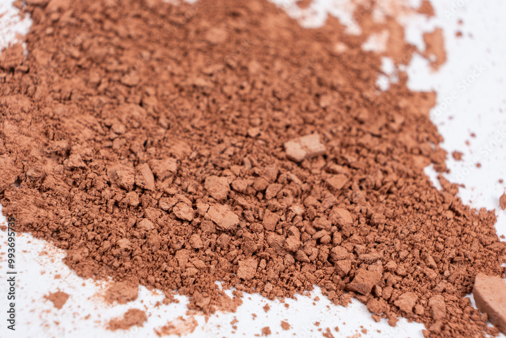 Scattered brown eyeshadow on a white background. Eye shadow texture Scattered brown eyeshadow on a white background. Eye shadow texture