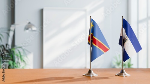 FLAGS OF CONGO DEMOCRATIC REPUBLIC AND EL SALVADOR ON TABLE photo