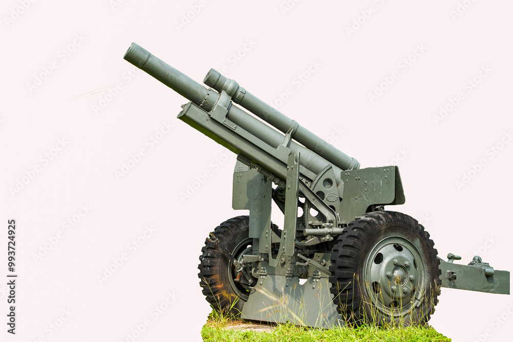 A large, green artillery piece is displayed on a grassy surface against a white background. The cannon has a long, barrelled tube and a complex system of wheels and supports. A large, green artillery piece is displayed on a grassy surface against a white background. The cannon has a long, barrelled tube and a complex system of wheels and supports.