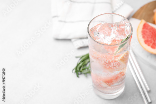 Wallpaper Mural Refreshing water with grapefruit and rosemary in glass on light table, closeup. Space for text Torontodigital.ca