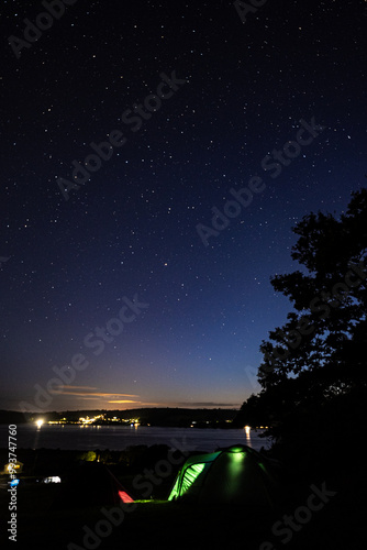 starry sky over a campsite photo