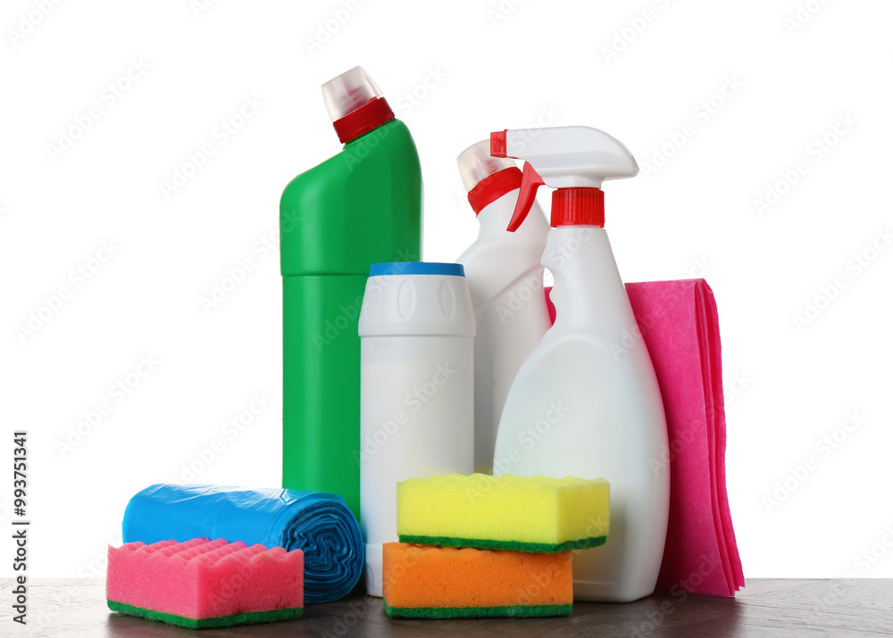 Different toilet cleaners, sponges, rag and trash bags on wooden table against white background Different toilet cleaners, sponges, rag and trash bags on wooden table against white background