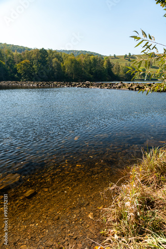 Rur in der Nähe der Rurtalsperre Schwammenauel beim Wasserkraftwerk Heimbach in der Eifel im Sommer bei schönem Wetter photo