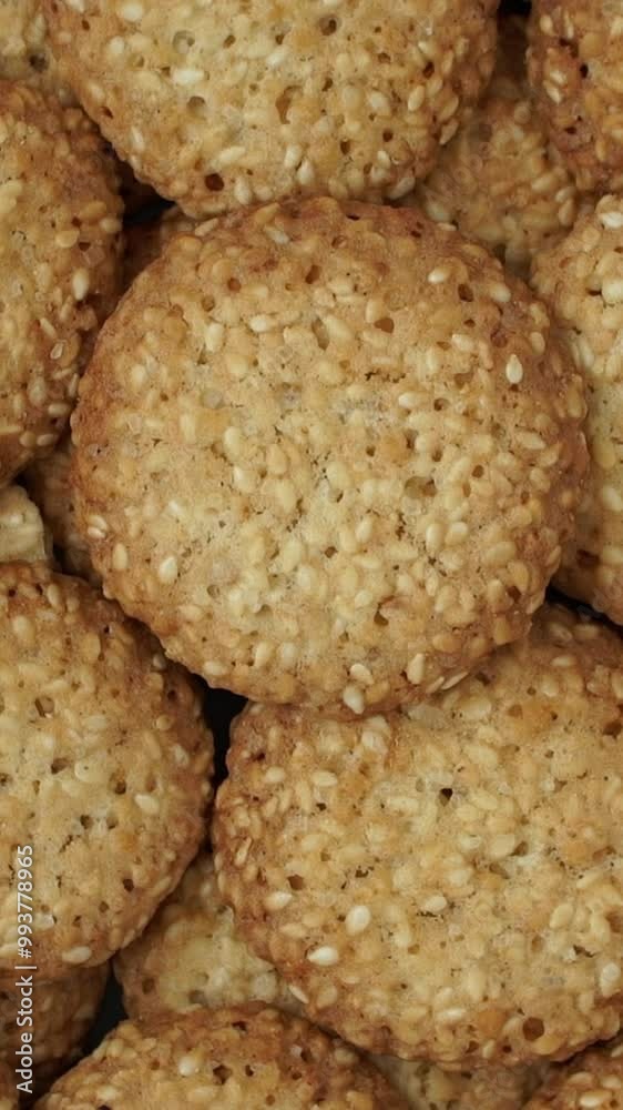 Top view of fresh baked cookies with sesame rotate in circle. Shortbread. Bakery concept. Vertical shot Top view of fresh baked cookies with sesame rotate in circle. Shortbread. Bakery concept. Vertical shot