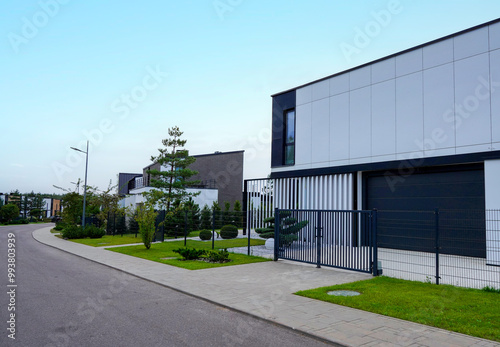 Wallpaper Mural Prefab house. Street in residential area. Contemporary Residence in suburb. Rows of modern houses along road. Family house, Modern Home outside city. Trees, green lawn at Modern Villa. Torontodigital.ca