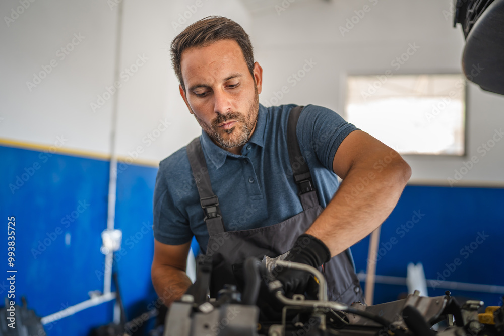 car mechanic work on car engine in bright workshop setting car mechanic work on car engine in bright workshop setting