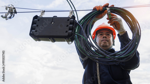 Cuadro en lienzo Engineer or technician checking fiber optic cables in internet splitter box