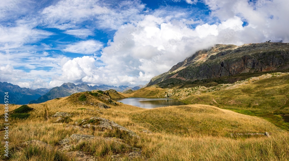 landscape with mountains and sky, lake Faucille in the Ecrins national park, French Alps landscape with mountains and sky, lake Faucille in the Ecrins national park, French Alps