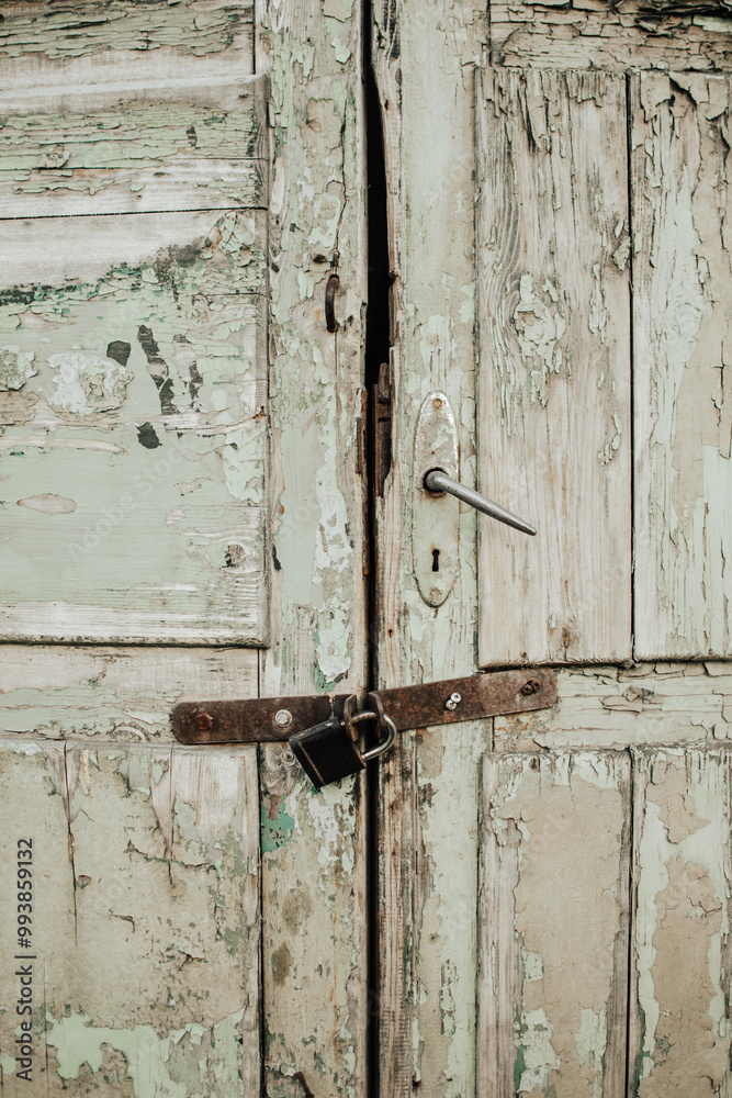 Boarded up old wooden door with padlock Boarded up old wooden door with padlock