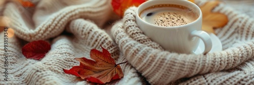 hot coffee in warm wool cloth, autumnal concept banner photo