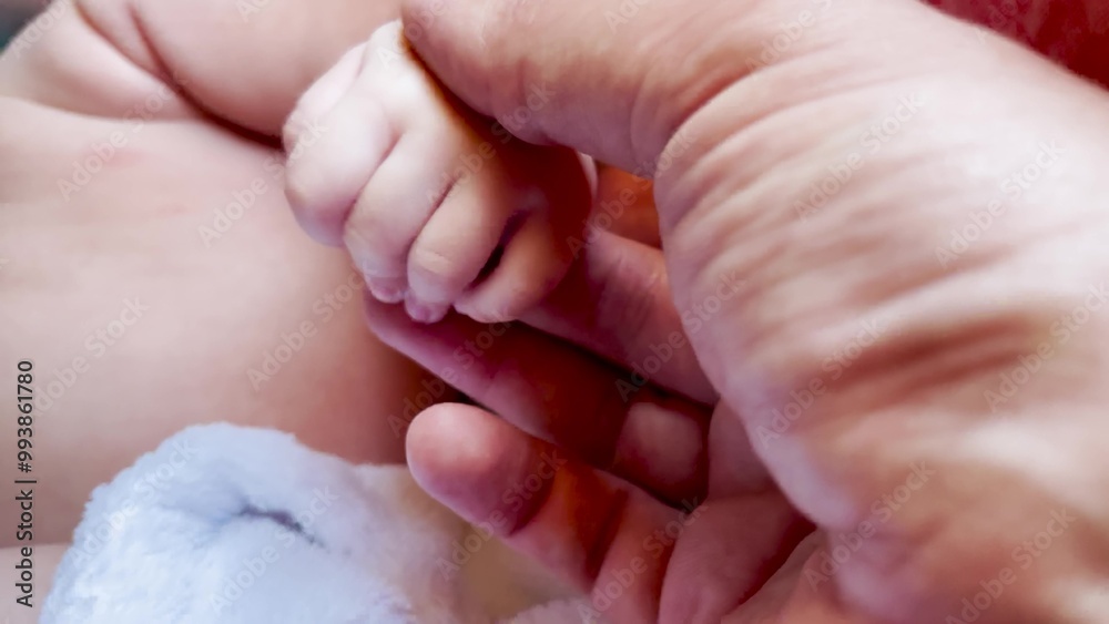 Baby is holding daddy hand. happy family child dream concept. close-up of a hand with a baby. close-up of father hand with baby. Close-up of newborn hand on lifestyle dad