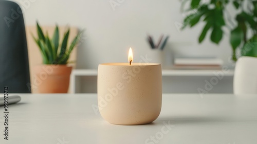 Minimalist workspace with a softly flickering candle, clean lines and soothing aroma, perfect for calm focus