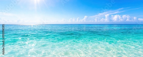 bright blue ocean surface on sunny day with blue sky background