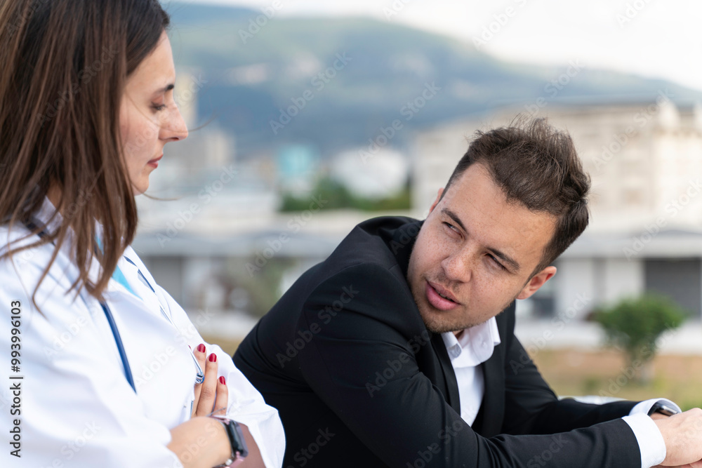 Portrait of Business Executive and Young Female Doctor Taking a Break and Engaging in Conversation Portrait of Business Executive and Young Female Doctor Taking a Break and Engaging in Conversation
