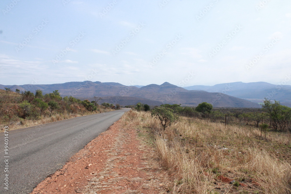 road with mountain in the background road with mountain in the background