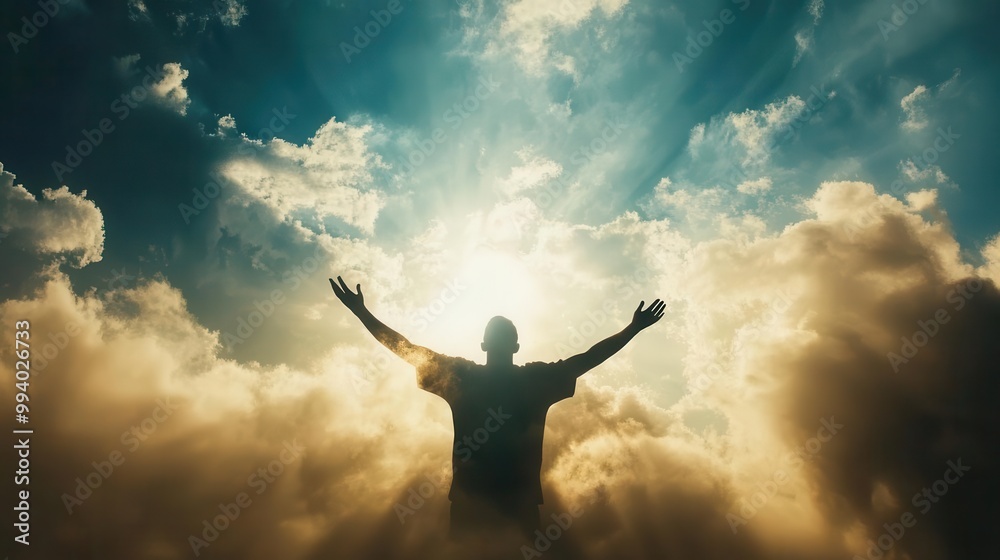 majestic cloudscape with divine light breaking through silhouette of outstretched arms in reverent pose majestic cloudscape with divine light breaking through silhouette of outstretched arms in reverent pose