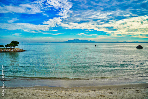 Morning sea views and calm over the stunning coast of Penang seen from Penang Beach towards the Malaysian mainland in Georgetown,Penang,Malaysia photo