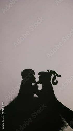 Romantic shadow puppet love story performance