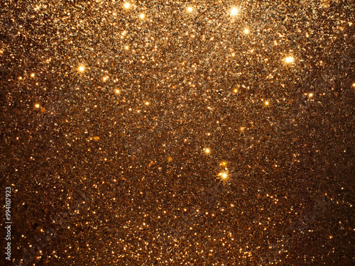Gold Glitter Background. Wallpaper Texture.