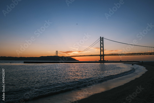 [HYOGO]Sunset view of Akashi Kaikyo Bridge, known as one of the world's largest suspension bridges, The orange sunset sky is beautiful, Azur Maiko, Japan