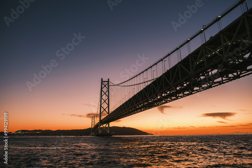 [HYOGO]Sunset view of Akashi Kaikyo Bridge, known as one of the world's largest suspension bridges, A bridge with a beautiful contrast against the evening sky, Azur Maiko, Japan photo