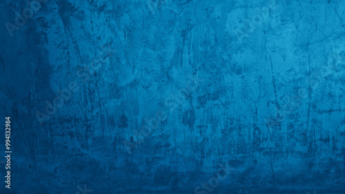 beautiful blue grunge stucco concrete texture use as background with blank space for design. artistic blue color cement wall background with light from above. beautiful light stucco surface.