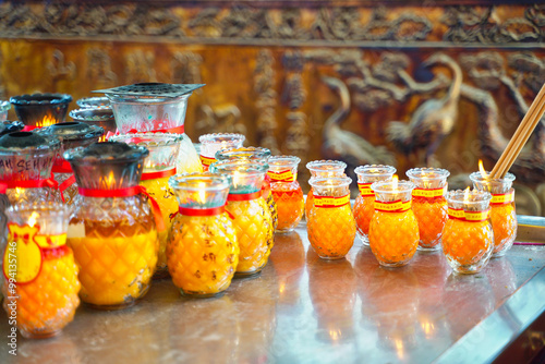 Bokeh soft focus image of Prayer candles,tea lights and votive offerings at the main prayer hall at the Kek Lok Si Temple in Georgetown,Penang,Malaysia photo