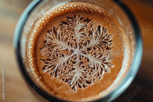 Close-up of Intricate Coffee Foam Design in a Glass photo