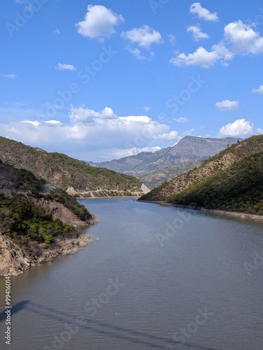 river flowing through lush green valley