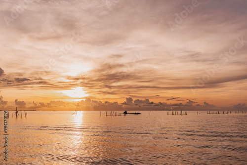 Morning scene of villager fish net in Songkhla lake, Phatthalung, Thailand. photo